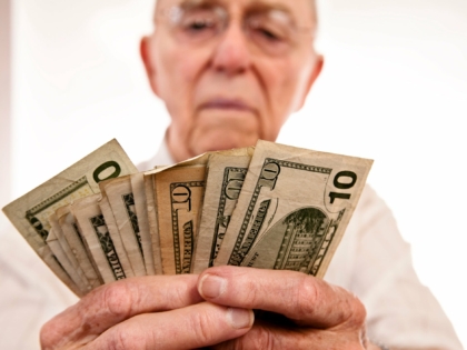 senior-fanning-cash-retirement-social-security-getty